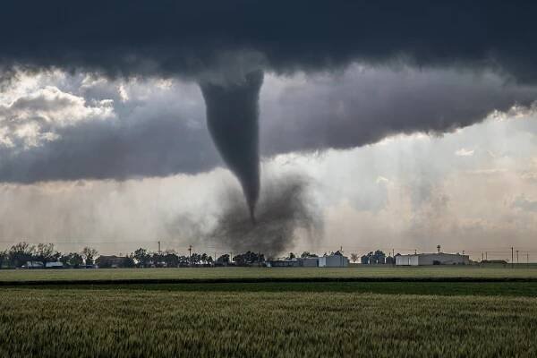 EF2 tornado lofting debris from a home in Lockett, Texas.