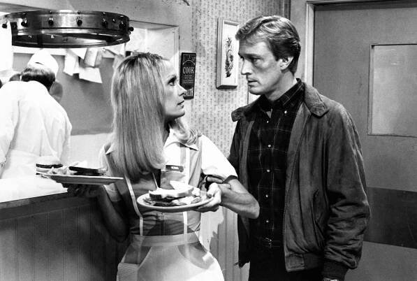Gary, played by actor Ted Shackelford, visits his wife Val, played by actress Joan Van Ark, at the restaurant where she works, in the CBS television series "Knots Landing."