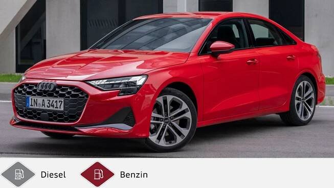 Rote Audi A3 Limousine steht vor modernem Gebäude, schräg von vorne aufgenommen. Unten graues Dieselsymbol und rotes Benzinsymbol.