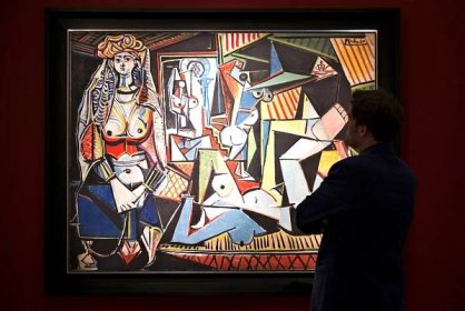 A man admires Pablo Picasso's Pablo Picasso's "Women of Algiers (Version O)" at Christie's auction house.
