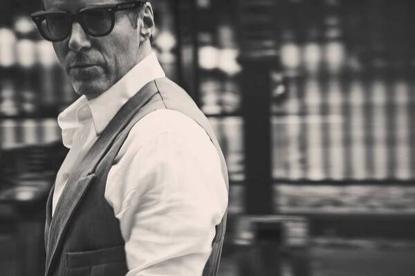 Vest, shirt by GIORGIO ARMANI; sunglasses byJACQUES MARIE MAGE.
