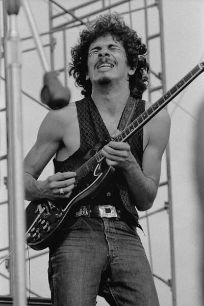 Mexican-born American guitarist Carlos Santana performing with his band 'Santana' at the Woodstock Music Festival in Bethel, New York, August 1969. (Photo by Tucker Ranson/Archive Photos/Getty Images)