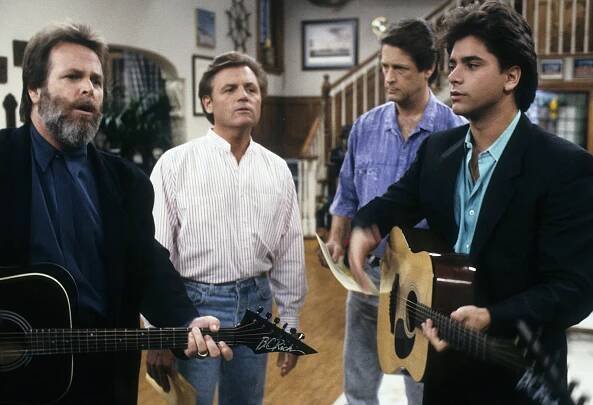 Beach Boys Carl Wilson, Bruce Johnston and Brian Wilson with John Stamos on "Full House" in 1988.