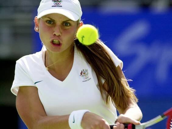 Action shot of Jelena Dokic fiercly preparing to return a serve 