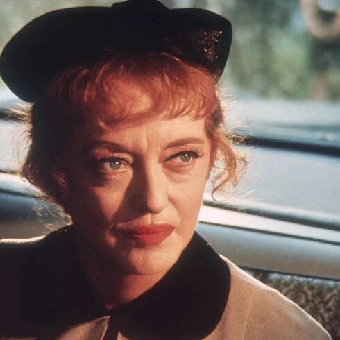 Forget Bette Davis' eyes, her 1950s living room features the romantic trend we're coveting for 2026 – it proves that floral curtains are truly timeless