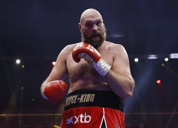 Tyson Fury reacting during a boxing match.
