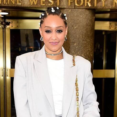Tia Mowry Wore An All-Gray Outfit Accessorized With Hair Shells—See Pics