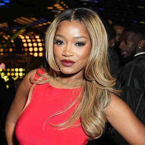 Keke Palmer with her wheat blonde hair and dark roots.