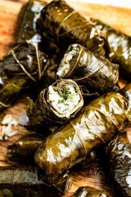Stuffed grape leaves are made of softened grape leaves wrapped around a flavorful filling of rice, fresh herbs, lemon, and pine nuts. 