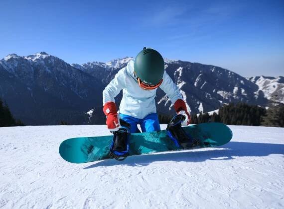 Snowboarding on alpine mountains