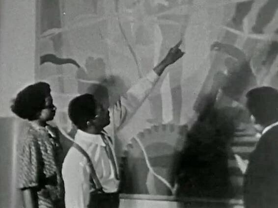See Aaron Douglas displaying some of his murals