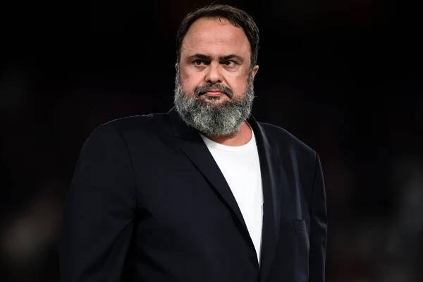 a man with a beard is wearing a black jacket