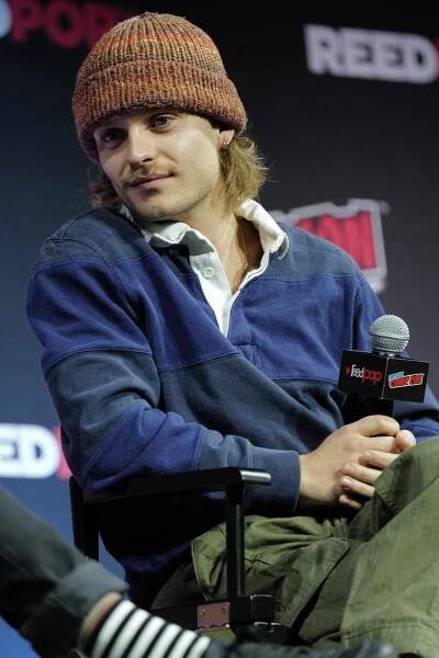 Tom Glynn-Carney speaks onstage at A Conversation with Matt Smith, Fabien Frankel and Tom Glynn-Carney during New York Comic Con 2024 at The Jacob K. Javits Convention Center on October 20, 2024 in New York City. 