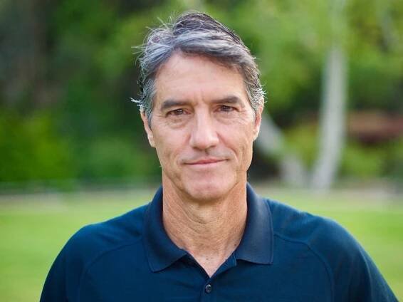 Photo of David Ryan standing outside.