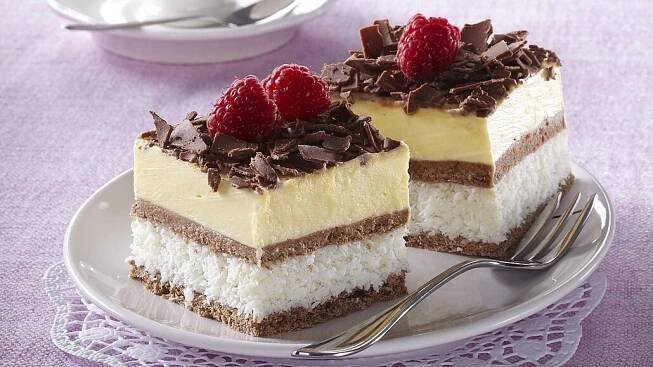 there is a piece of cake with chocolate and raspberries on it
