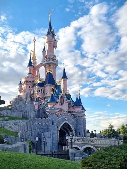 blue and pink fairytale castle at disneyland Paris