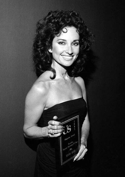 Susan Lucci holding award from Us Magazine in 1983