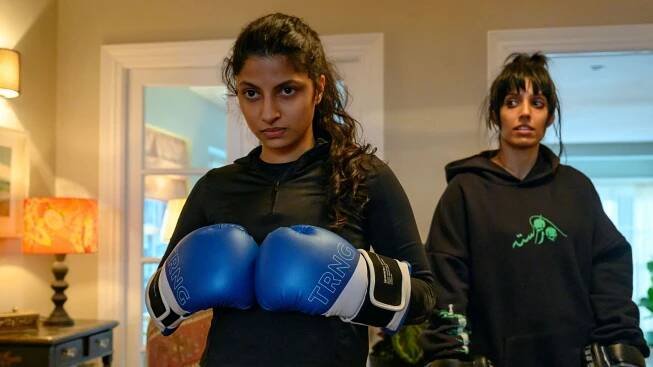 Priya Kansara and Ritu Arya in a still from the film, boxing.