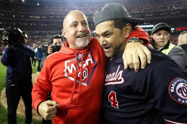 Mike Rizzo (left) celebrates with Nationals manager Dave Martinez