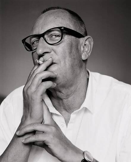 Norbert Schwontkowski smoking a cigarette.