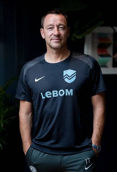 John Terry in a black shirt with the Lebom logo.