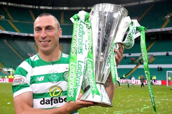 File photo dated 19-05-2019 of Celtic's Scott Brown celebrates with the trophy after winning the Ladbrokes Scottish Premiership match at Celtic Park, Glasgow. PA Photo.Issue date: Monday May 18, 2020. Celtic have been crowned champions of the Ladbrokes Premiership and Hearts relegated after a decision was made to conclude the season with immediate effect, the SPFL has announced. See PA story SOCCER SPFL. Photo credit should read Jane Barlow/PA Wire.