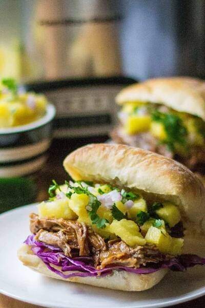 Slow Cooker Hawaiian Pulled Pork Sandwich is a sweet and spicy tropical twist on classic pulled pork sandwiches... and made with only THREE ingredients!