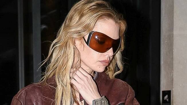 Stella Maxwell turns heads in suspender tights at Costes in Paris