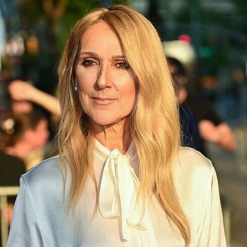Céline Dion wearing a white button down blouse tucked into a matching maxi skirt at the 'I Am: Celine Dion' New York premiere June 2024