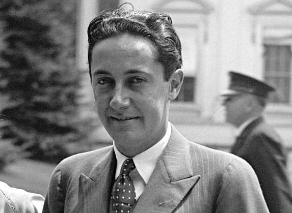 Irving Thalberg wearing grey suit is smiling at camera - 1929