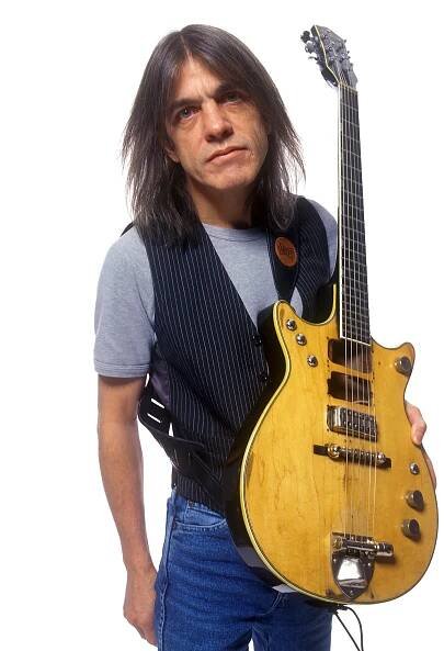 Malcolm Young, Whose Guitar Riffs Helped Propel AC/DC to Fame, Dies at 64