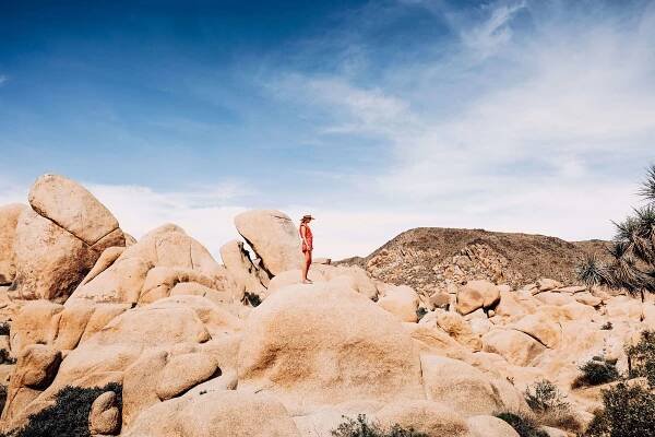 Girl standing on desert rocks