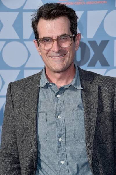 Ty Burrell smiling at an event