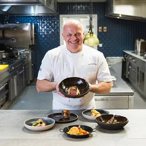 Chef Paul bates in the kitchen showing off his beautiful and delicious food dishes