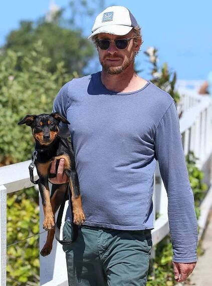 EXCLUSIVE: The Mentalist Simon Baker takes his cute puppy for a walk in Sydney