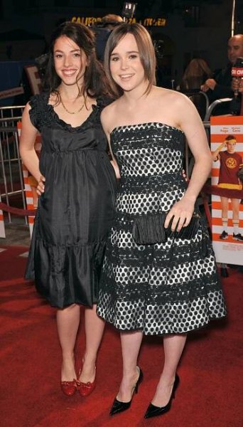 Olivia Thirlby adds a pop of color with red bow-adorned pumps, while Elliot Page keeps it classic in black pointed-toe heels paired with a chic strapless polka-dot dress at the Juno Los Angeles premiere on December 3, 2007