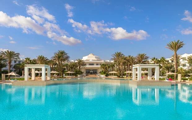 Radisson Blu Palace Djerba resort pool and building.
