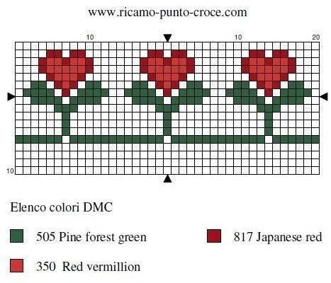 a cross stitch pattern with three red flowers on the side and one green flower in the middle