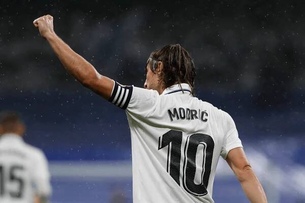 Luka Modric celebrates with Real Madrid