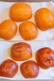 a baking sheet of pumpkin halves cut side down and then them all roasted.