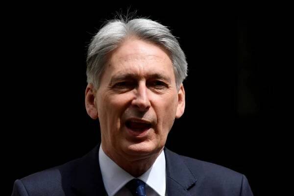 : Britain's Chancellor of the Exchequer Philip Hammond leaves Downing Street in London