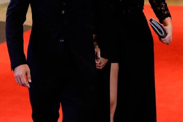 Manchester City striker Sergio Aguero and his girlfriend Karina Tejeda pose for a photo as they arrive to attend the wedding of Lionel Messi and Antonella Roccuzzo, in Rosario, Argentina, Friday, June 30, 2017. Some 260 guests, including teammates and former teammates of the Barcelona soccer star are attending the highly anticipated ceremony. (AP Photo/Victor R. Caivano)