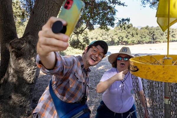 Comedian Allan McLeod takes a selfie with actor Betsy Sodaro outdoors in Pasadena.