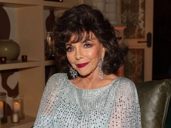 Joan Collins is the ultimate vixen in daring thigh-high split dress