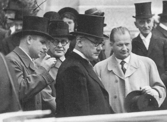 A photograph of four prominent Liechtenstein politicians in 1938. Standing from the left are Alois Vogt, Otto Schaedler, Josef Hoop and Ludwig Marxer.