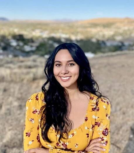 Photo of Brittney Guitierrez in Reno in the fall with rolling hills in the background