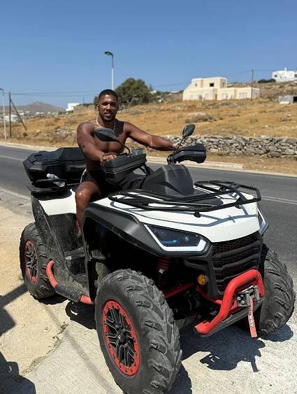 Anthony Joshua riding a quad bike in Mykonos.