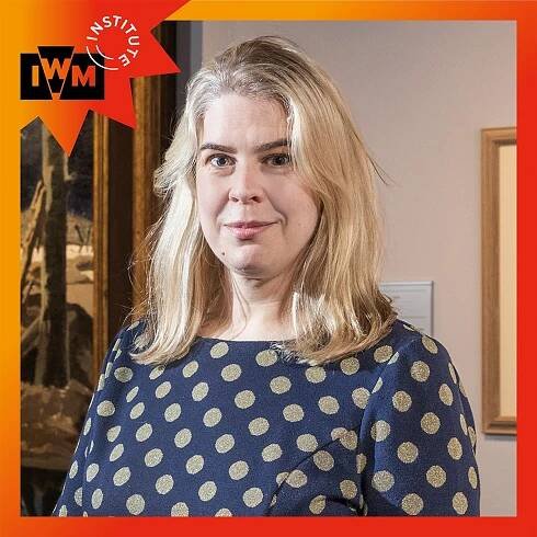 Helen Lewis posing in the Blavatnik Film and Photography Galleries at IWML