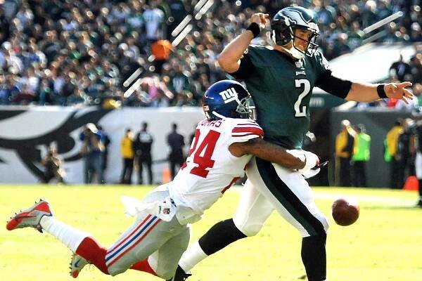 Terrell Thomas strips Matt Barkley in the Giants' 15-7 win over the Eagles.