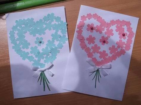 two valentine's day cards with flowers in the shape of a heart on them